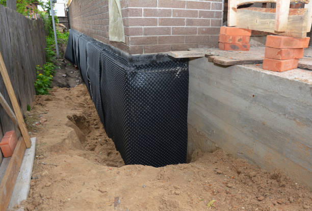 Happy homeowners after waterproofing job in Farmersburg